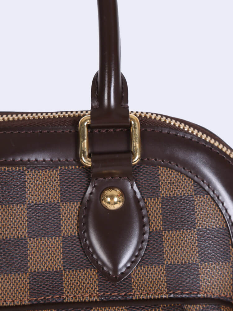 LOUIS VUITTON. Bag Trevi PM in Damier canvas and choco…